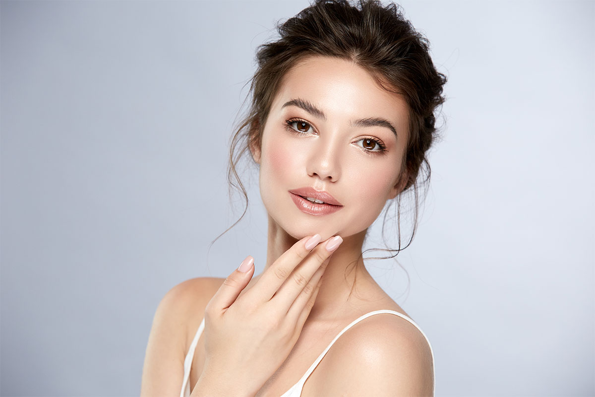 Woman with bright, clear skin after treatment with the Plasma Pen in Scottsdale.